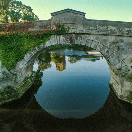 Atcham Bridge, a historic stone arch bridge crossing the River Severn in Shropshire, England.