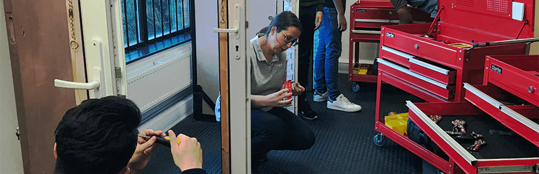 Locksmith trainees working on upvc doors