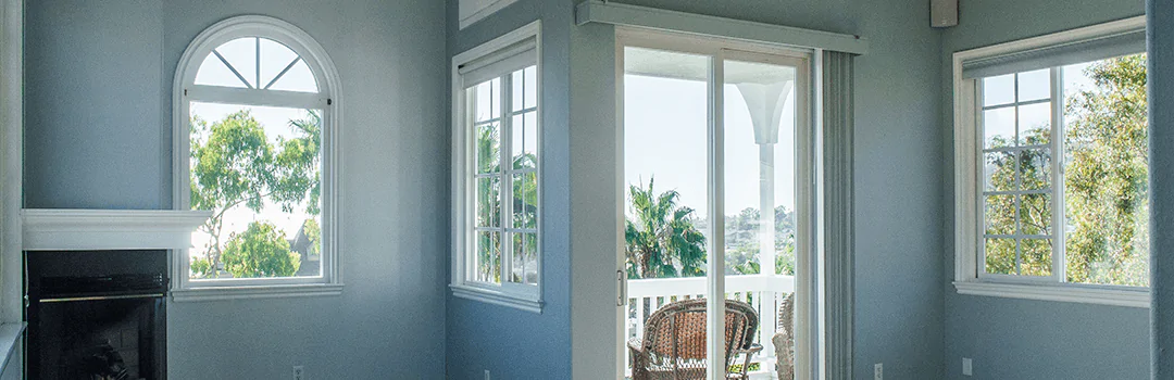 inside house with door and three windows