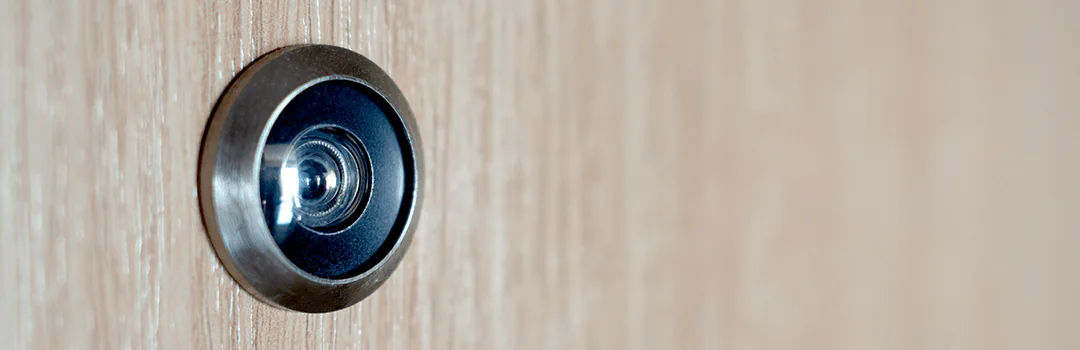 peephole on wooden hotel door
