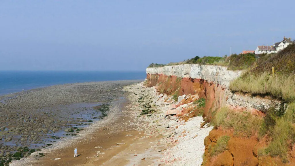 View of Hunstanton beach from the cliff top showing famous lines on cliff and out to sea.