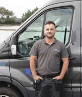 Locksmith stood in front of van